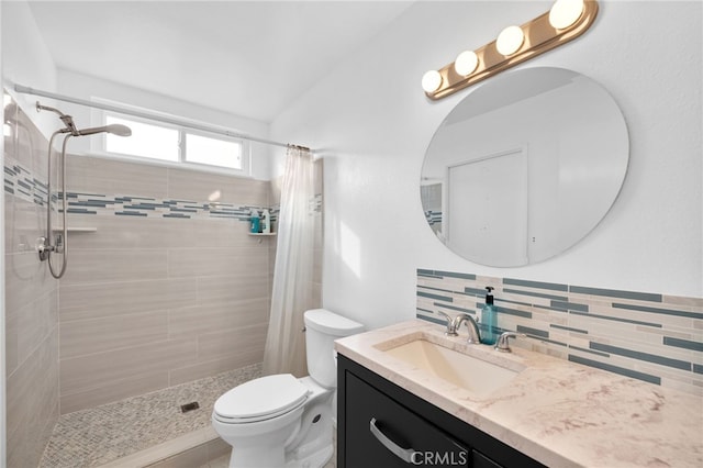 bathroom featuring decorative backsplash, toilet, vanity, and a shower with curtain