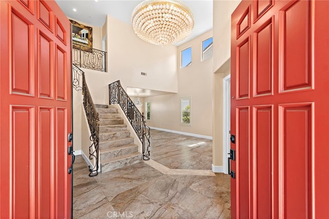 2438 Calle Aquamarina, San Clemente, CA 92673 - foyer featuring marble tiled flooring, a chandelier, baseboards, stairway, and healthy amount of natural light
