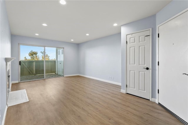 spare room with light hardwood / wood-style floors