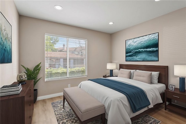 bedroom with light hardwood / wood-style floors