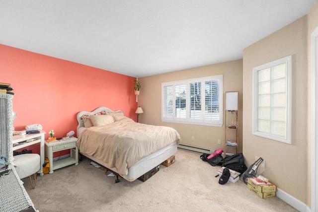 carpeted bedroom featuring a baseboard radiator