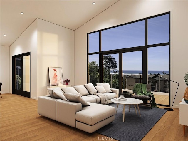 living room with high vaulted ceiling and light wood-type flooring