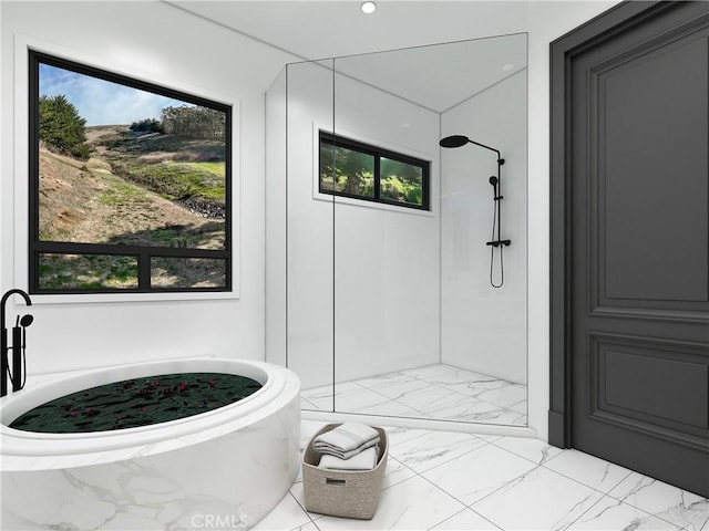 bathroom featuring plus walk in shower and a wealth of natural light