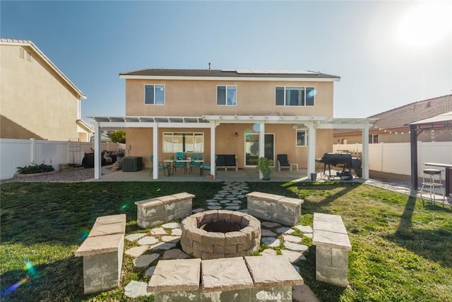 back of property featuring a pergola, an outdoor living space with a fire pit, a patio, a yard, and cooling unit