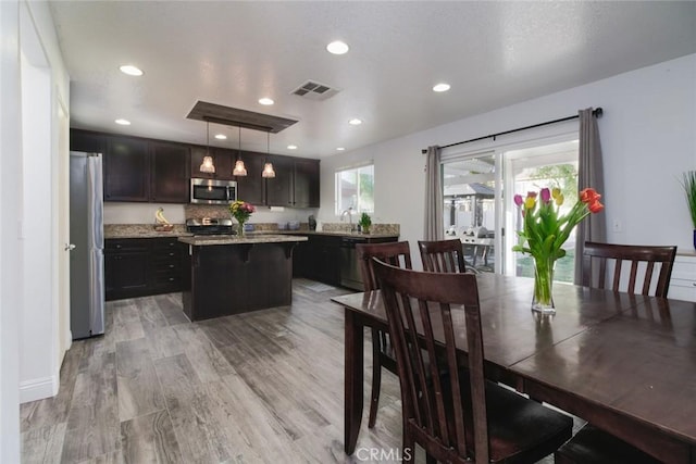 dining area with light hardwood / wood-style flooring