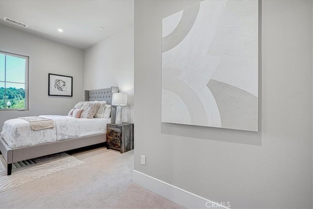 bedroom featuring baseboards, recessed lighting, visible vents, and light colored carpet