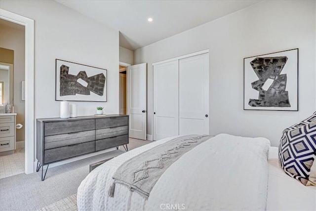 carpeted bedroom featuring a closet