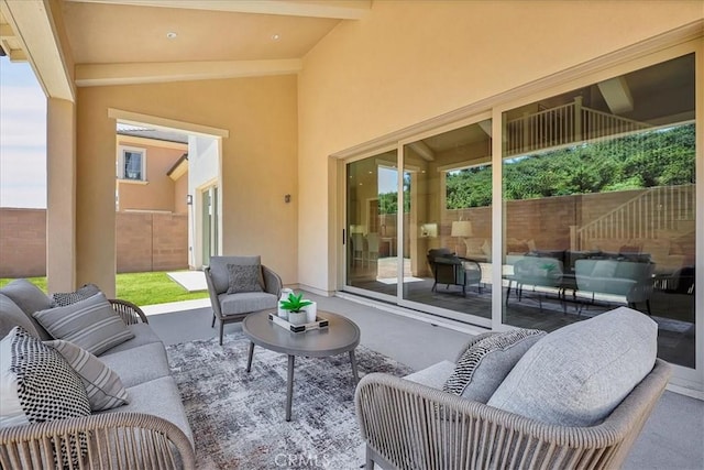 view of patio with fence and an outdoor hangout area