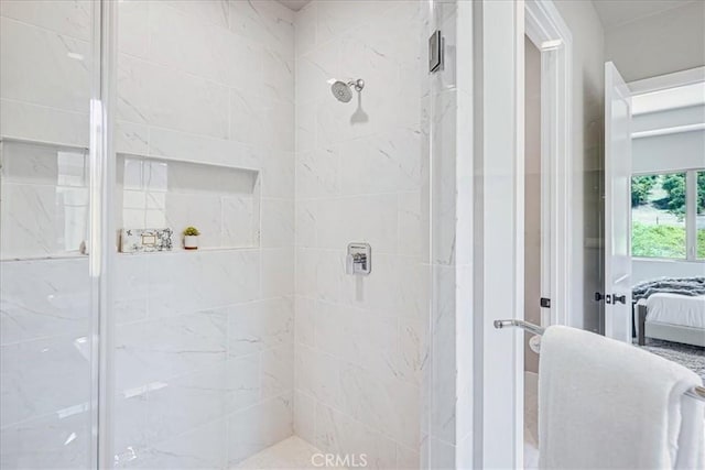 bathroom featuring a shower with shower door