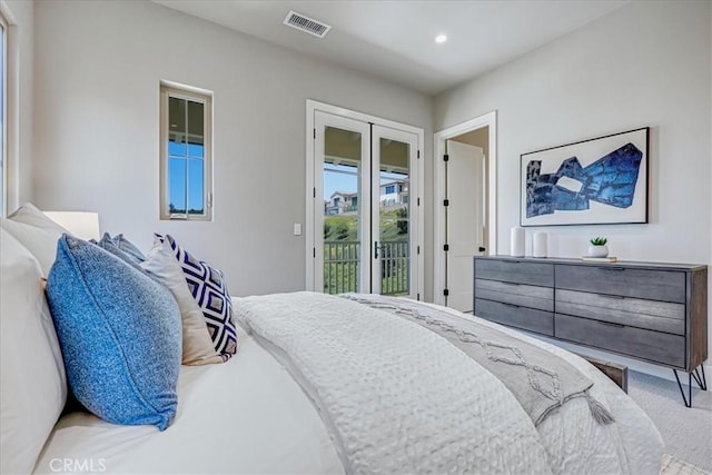 bedroom featuring access to outside, visible vents, and recessed lighting