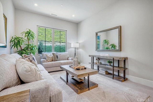 living room with recessed lighting, visible vents, and baseboards