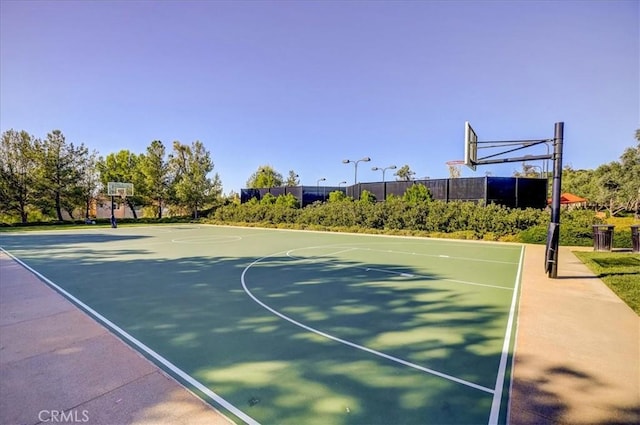 view of sport court featuring community basketball court and fence