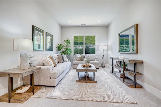 living room with light carpet, recessed lighting, visible vents, and baseboards