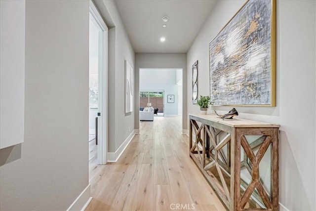 hall with light hardwood / wood-style flooring