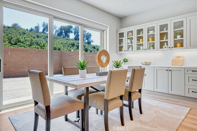 dining area with light hardwood / wood-style floors