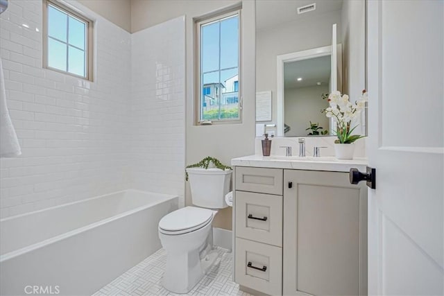 full bathroom featuring toilet, vanity, tile patterned flooring, and bathing tub / shower combination