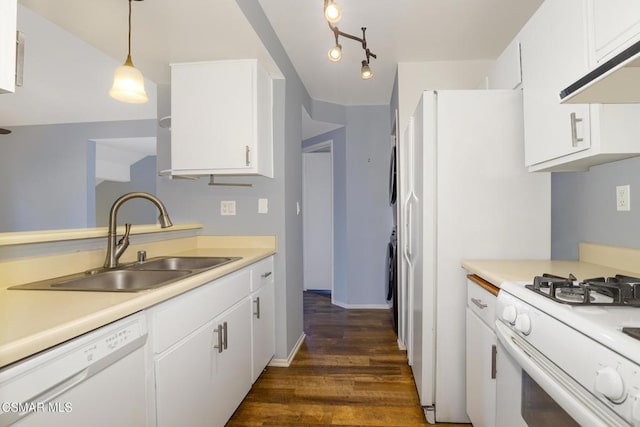 kitchen with white cabinets, sink, white appliances, and pendant lighting