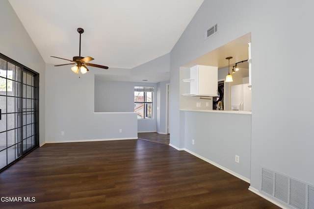 unfurnished living room with ceiling fan, dark hardwood / wood-style flooring, and lofted ceiling