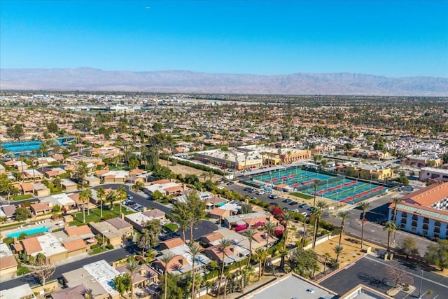 birds eye view of property with a mountain view