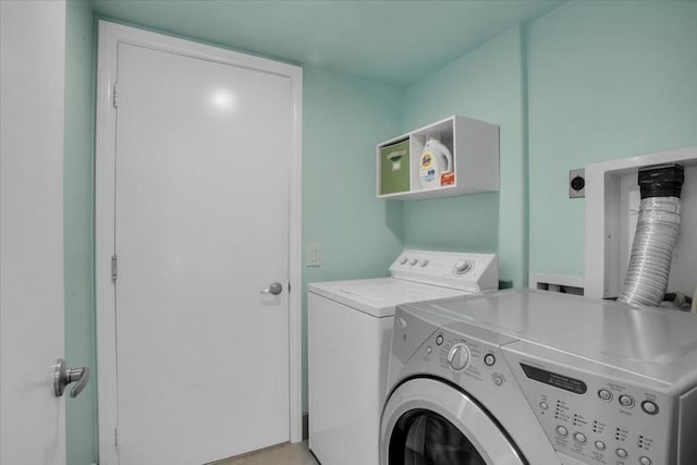 washroom featuring washer and clothes dryer