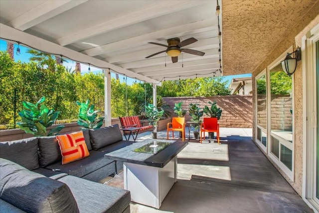 view of patio / terrace featuring an outdoor living space with a fire pit and ceiling fan