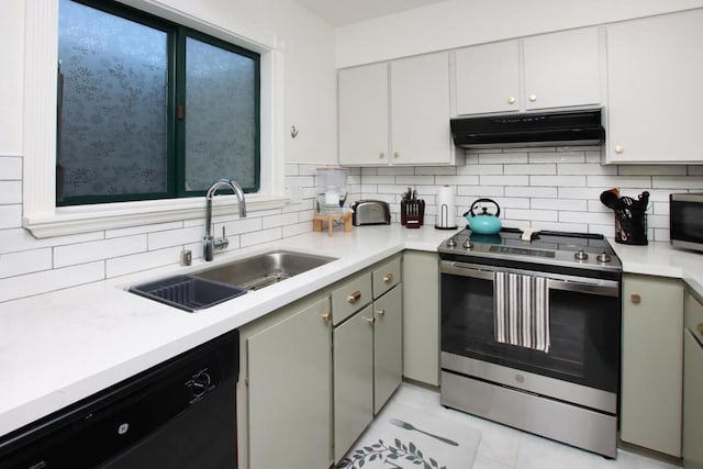 kitchen with decorative backsplash, sink, white cabinetry, stainless steel appliances, and light tile patterned floors