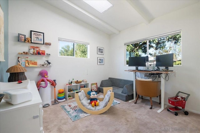 rec room with lofted ceiling with beams and light colored carpet