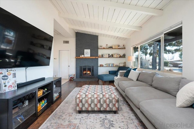 living room featuring wooden ceiling, vaulted ceiling with beams, a large fireplace, and dark hardwood / wood-style flooring