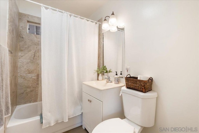 full bathroom with vanity, shower / tub combo with curtain, and toilet