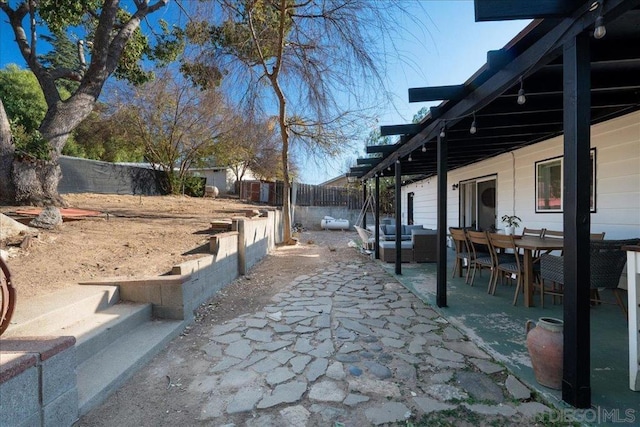 view of yard with an outdoor living space and a patio