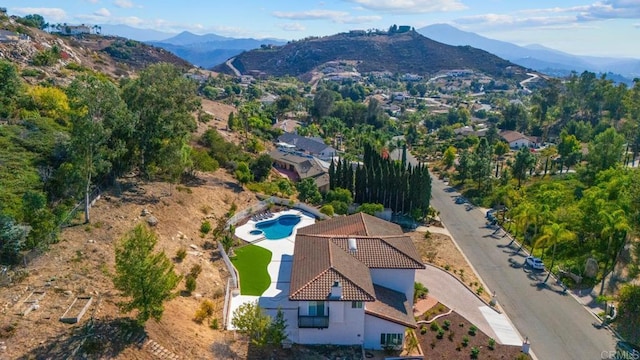 birds eye view of property with a mountain view