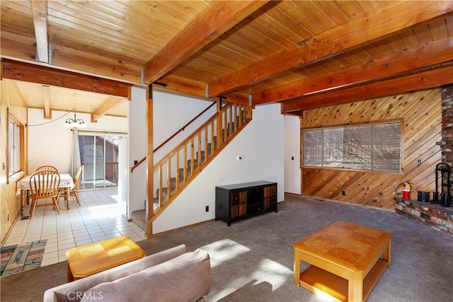 tiled living room featuring an inviting chandelier, wood ceiling, beam ceiling, and wood walls