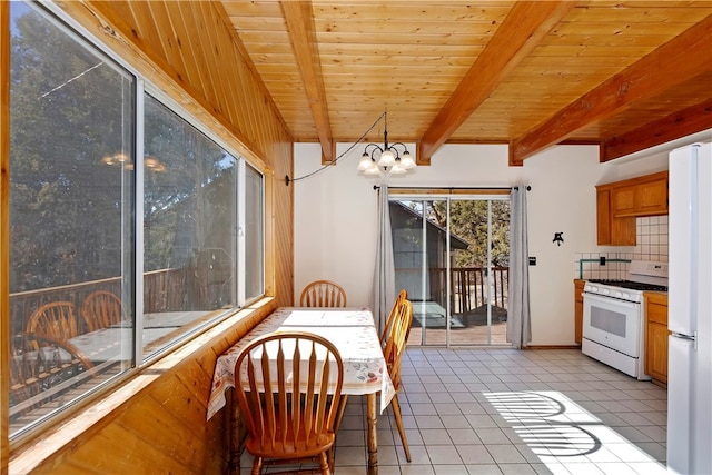 dining room featuring beamed ceiling, a chandelier, light tile patterned floors, and wooden ceiling