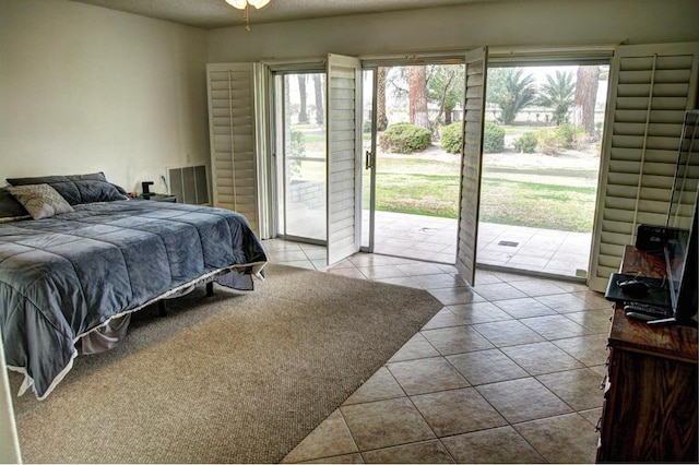 tiled bedroom with access to outside