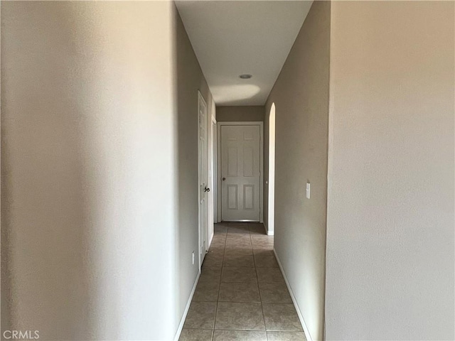 hall with tile patterned flooring