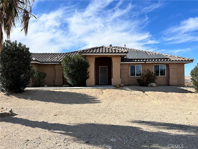 view of front of home with solar panels