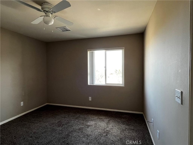 spare room featuring carpet flooring and ceiling fan