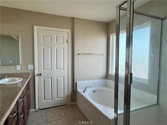 bathroom featuring vanity, a wealth of natural light, separate shower and tub, and tile patterned flooring