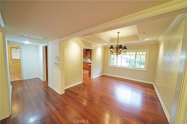 unfurnished room featuring crown molding, a notable chandelier, dark hardwood / wood-style floors, and a raised ceiling