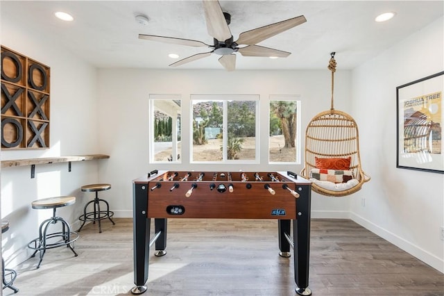 rec room featuring hardwood / wood-style flooring and ceiling fan