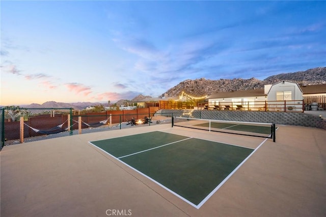 view of sport court with a mountain view