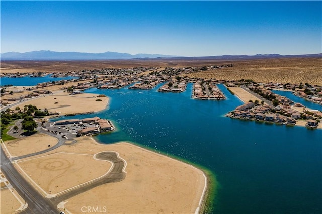 drone / aerial view with a water and mountain view