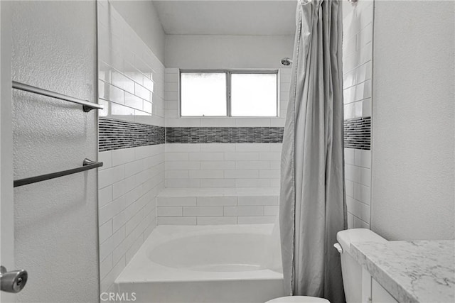 full bathroom with shower / bath combo with shower curtain, toilet, and vanity