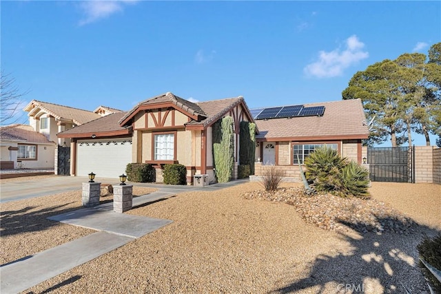 view of front of home with a garage and solar panels