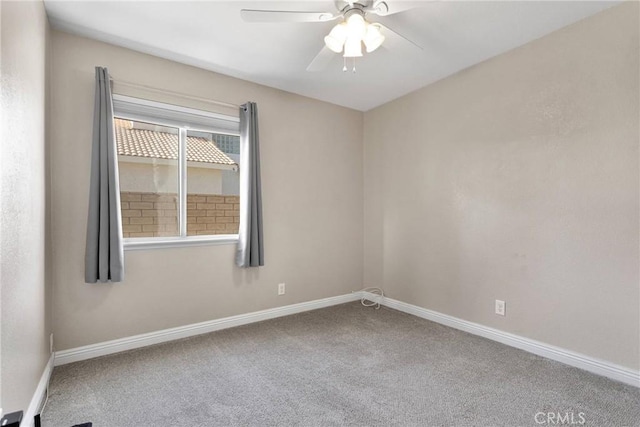 carpeted empty room with ceiling fan