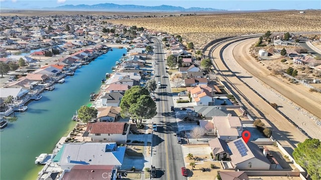 aerial view featuring a water and mountain view