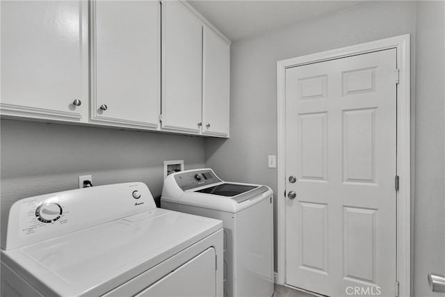 laundry area with cabinets and washer and dryer