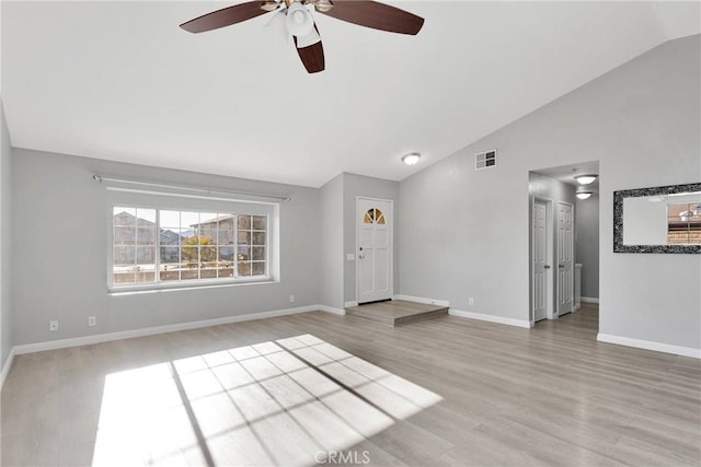 unfurnished living room featuring light hardwood / wood-style flooring and vaulted ceiling