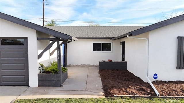 doorway to property featuring a garage