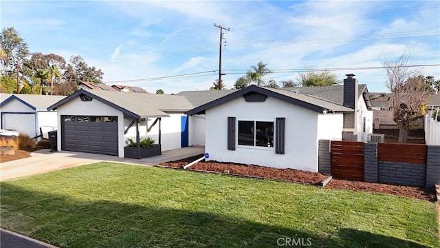 view of front of house with a garage and a front yard